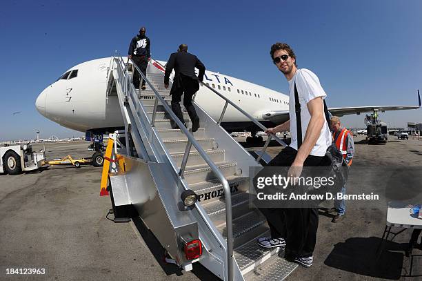 Pau Gasol of the Los Angeles Lakers boards the plane to begin the trip to Beijing, China as part of the 2013 NBA Global Games on October 11 at Los...