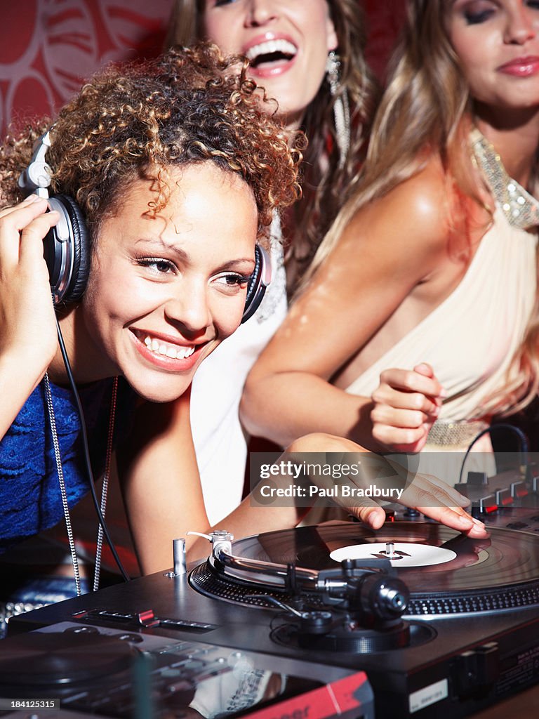 Woman with DJ at a club