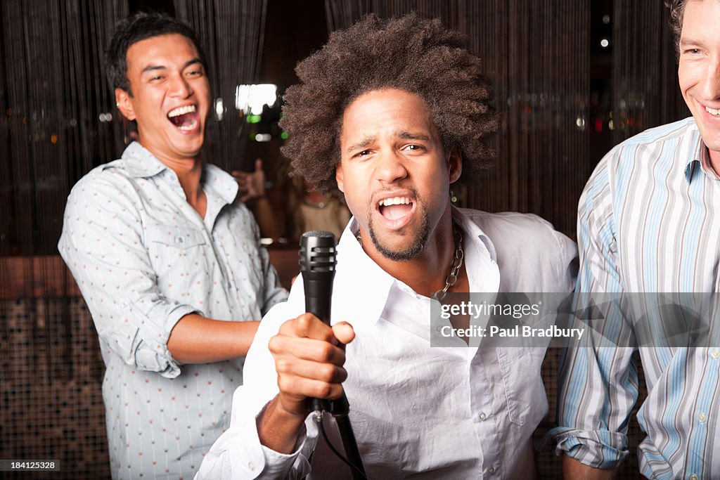 Friends singing out at a club