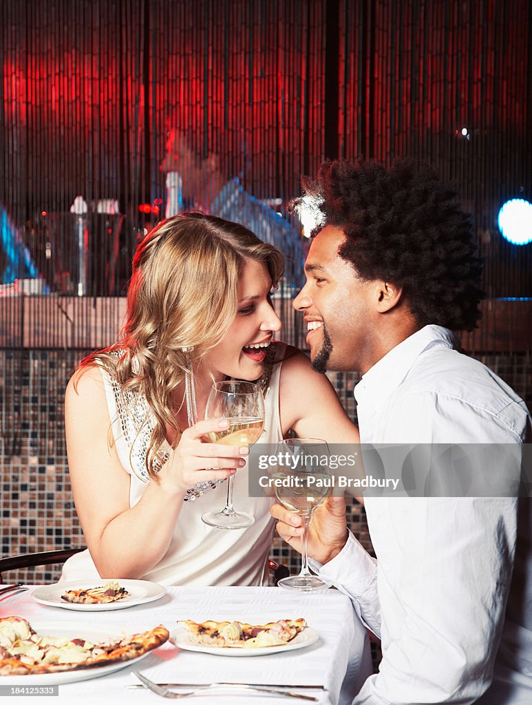 Man and woman eating dinner at restaurant
