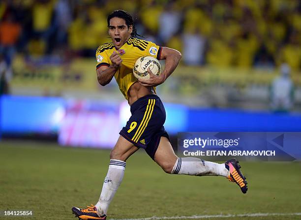 Colombia's forward Radamel Falcao Garcia celebrates after scoring a penalty against Chile during their Brazil 2014 FIFA World Cup South American...