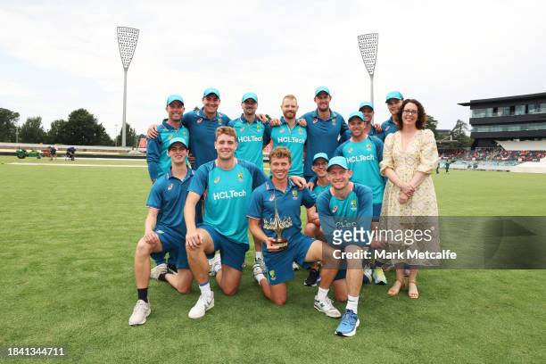 The Prime Ministers XI pose with Labor member for Canberra Alicia Payne and the Prime Ministers XI trophy during day four of the Tour match between...