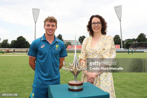 Nathan McSweeney of the Prime Ministers XI poses with Labor member for Canberra Alicia Payne and the Prime Ministers XI trophy during day four of the...