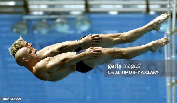 Britain's synchronized diving team Leon Taylor and Pete Waterfield pratice their routine 16 July 2005 in preparation for the 2005 XI FINA World...