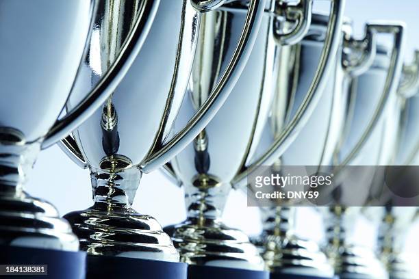 row of trophies - trophy award stock pictures, royalty-free photos & images