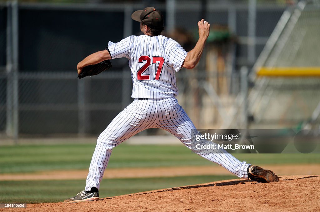 Baseball pitcher throwing the ball