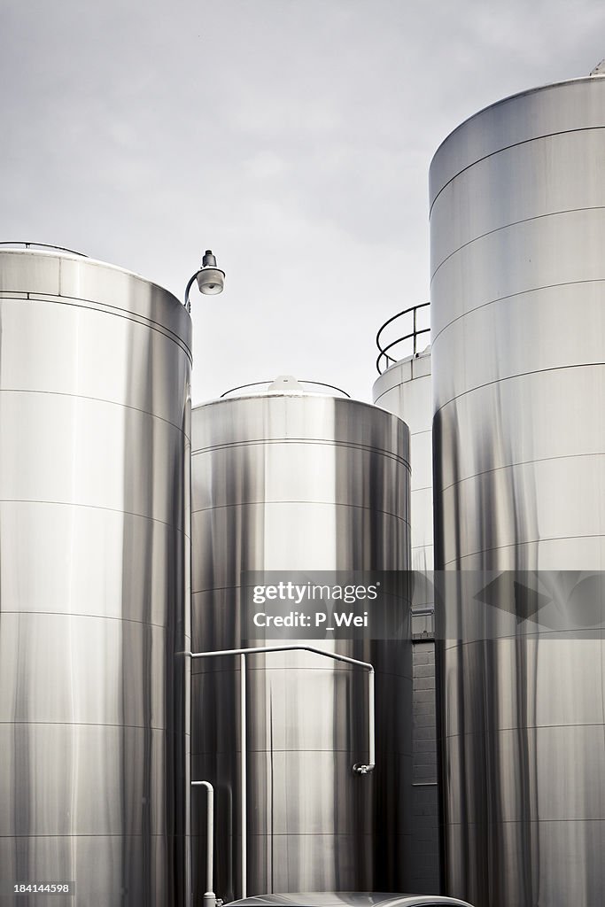 Tall chemical silos for food storage close together