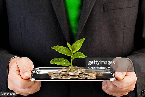 seedlings and euro coins - esg stock pictures, royalty-free photos & images