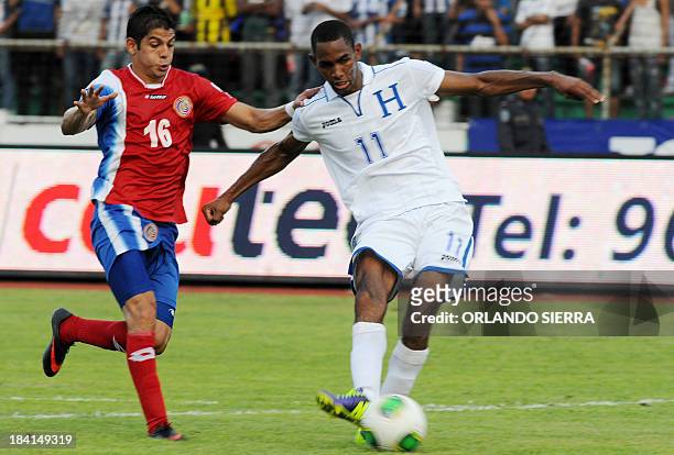 Hondura's Jerry Bengtson scores against Costa Rica, during the 2014 World Cup qualifiers football match at Olimpico Metroplitano stadium in San Pedro...