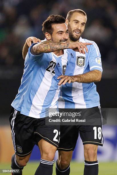 Ezequiel Lavezzi and Rodrigo Palacio celebrate a goal during a match between Argentina and Peru as part of the 17th round of the South American...