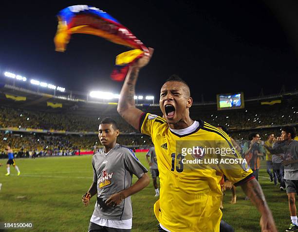 Colombia's midfielder Fredy Guarin celebrates after qualifying for the Brazil 2014 FIFA World Cup after a 3-3 tie with Chile in a South American...