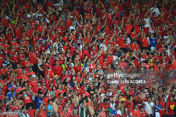 Supporters of Chile celebrate a goal against Colombia during the Brazil 2014 FIFA World Cup South American qualifier match, in Barranquilla,...