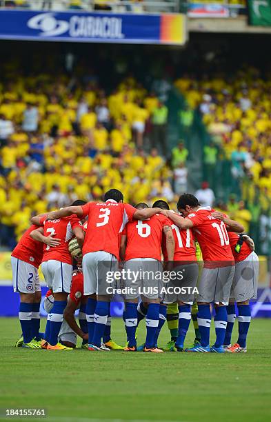 Chile's national football team players gather before the start of the Brazil 2014 FIFA World Cup South American qualifier against Colombia, in...