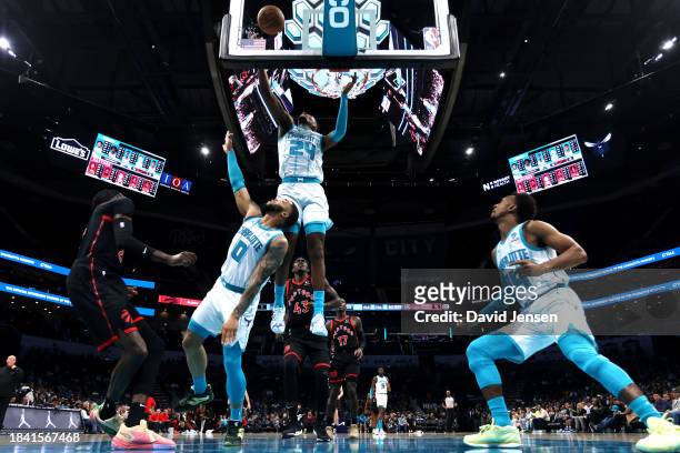 Brandon Miller of the Charlotte Hornets blocks a shot during the first half of an NBA game against the Toronto Raptors at Spectrum Center on December...