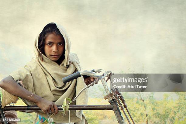 the bicycle girl - rajasthani youth stockfoto's en -beelden