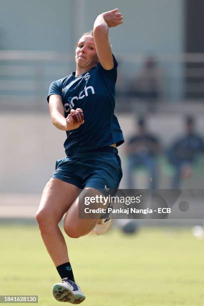 Kate Cross of England delivers a ball during a net session at DY Patil Stadium on December 12, 2023 in Navi Mumbai, India.