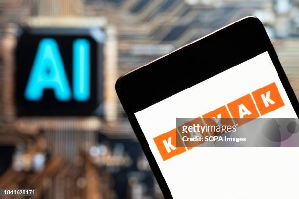 In this photo illustration, the travel search engine Kayak logo seen displayed on a smartphone with an Artificial intelligence chip and symbol in the...
