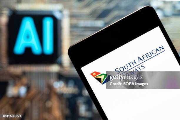 In this photo illustration, the South African Airways airline logo seen displayed on a smartphone with an Artificial intelligence chip and symbol in...