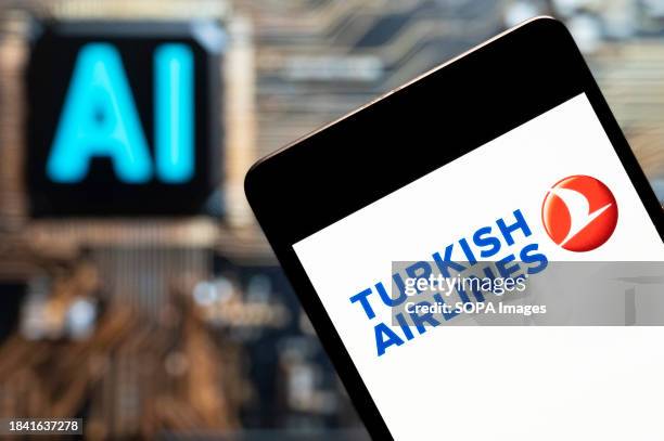 In this photo illustration, the Turkey's national flag carrier airline Turkish Airlines logo seen displayed on a smartphone with an Artificial...