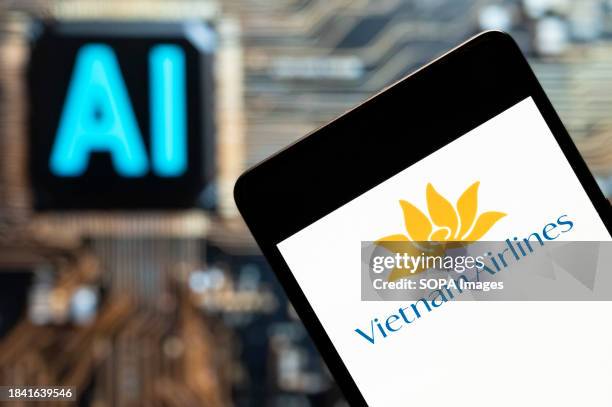 In this photo illustration, the Vietnamese airline, Vietnam Airlines, logo seen displayed on a smartphone with an Artificial intelligence chip and...