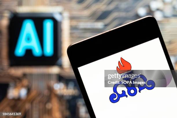 In this photo illustration, the National Iranian Oil Company logo seen displayed on a smartphone with an Artificial intelligence chip and symbol in...