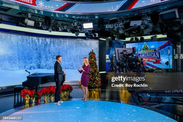 In this image released on December 8, musician Michael W. Smith speaks with host Ainsley Earhardt as he visits "Fox & Friends" at Fox News Channel...