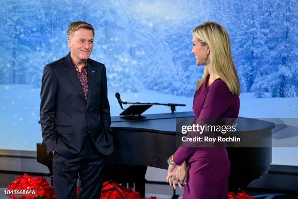 In this image released on December 8, musician Michael W. Smith speaks with host Ainsley Earhardt as he visits "Fox & Friends" at Fox News Channel...