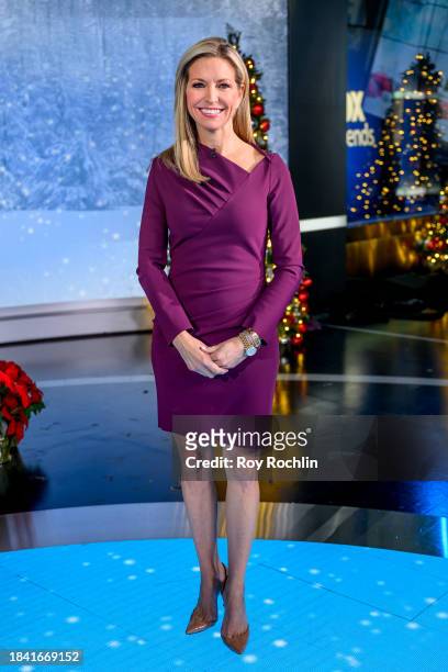 In this image released on December 8, host Ainsley Earhardt attends as Musician Michael W. Smith visits "Fox & Friends" at Fox News Channel Studios...