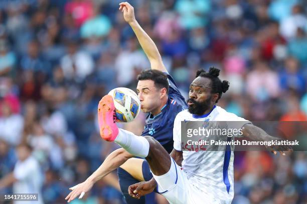 Peter Utaka of Ventforet Kofu controls the ball against Dion Johan Chai Cools of Buriram United during the AFC Champions League Group H match between...