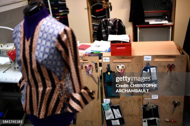 This picture shows the tools used by inmates during dressmaking courses hanging on a wood panel at the Bordeaux-Gradignan jail in Gradignan on the...