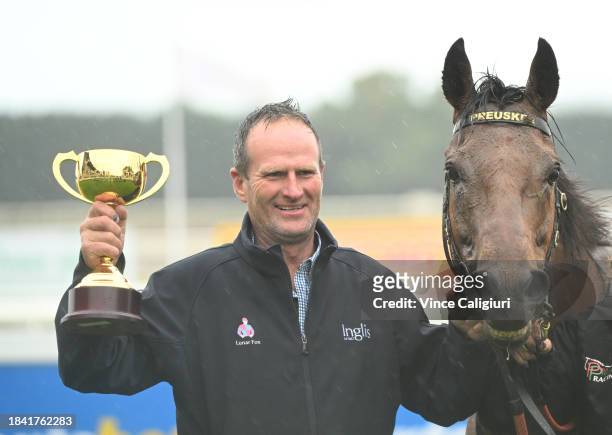 Trainer Paul Preusker poses with the cup after Captain Envious won Race 8, the Sportsbet Ballarat Cup, during Melbourne Racing at Ballarat Racecourse...