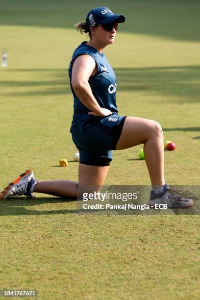 Alice Capsey of England warms up during a net session at DY Patil Stadium on December 12, 2023 in Navi Mumbai, India.