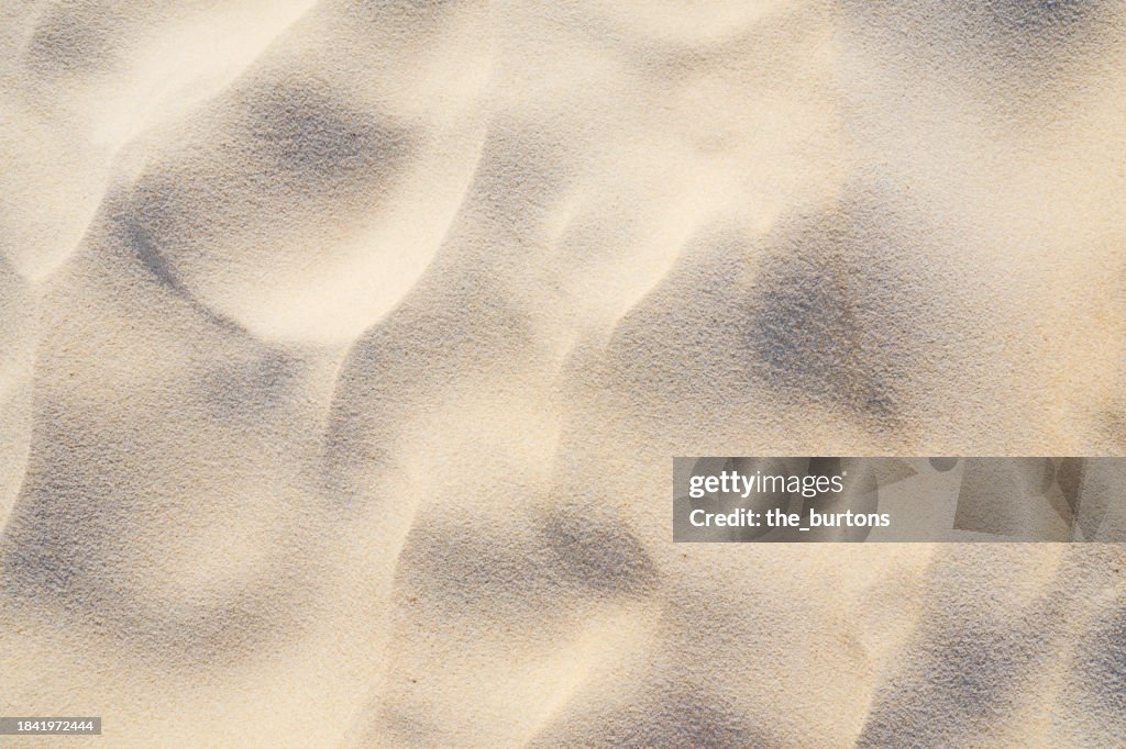 Full frame shot of sand area on the beach, abstract background