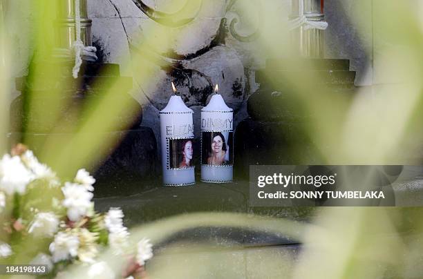 Candles with pictures of victims are seen at the Bali bombing memorial as the 11th anniversary of the terror attack is marked in Kuta, near Denpasar...