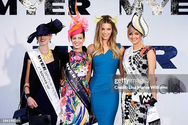 Jennifer Hawkins poses with fashions on the field finalists during Spring Champion Stakes day at Royal Randwick on October 12, 2013 in Sydney,...