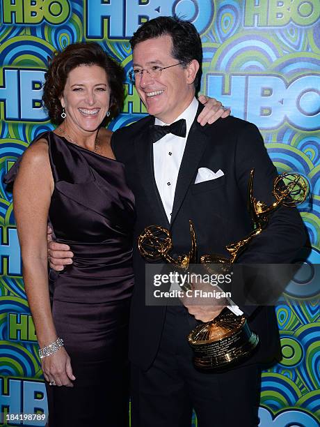 Comedian Stephen Colbert with his awards for Outstanding Variety Series won for 'The Colbert Report' and wife his Evelyn Mcgee-Colbert arrive at...