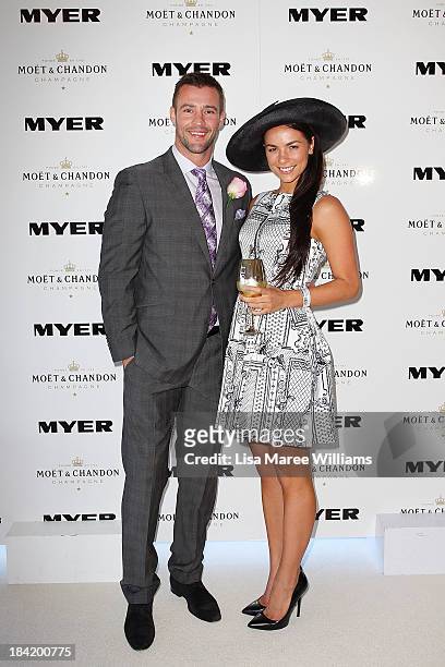 Kris Smith and Maddy King pose inside the Moet and Chandon Marquee during Spring Champion Stakes Day at Royal Randwick on October 12, 2013 in Sydney,...