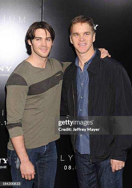 Actor Steven R. McQueen and former NHL player Luc Robitaille arrive at the Los Angeles premiere of 'Elysium' at Regency Village Theatre on August 7,...