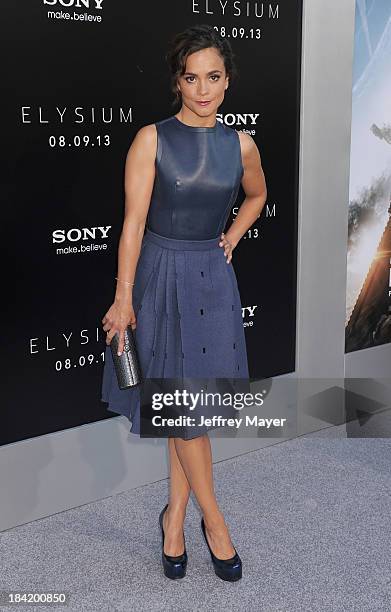 Actress Alice Braga arrives at the Los Angeles premiere of 'Elysium' at Regency Village Theatre on August 7, 2013 in Westwood, California.