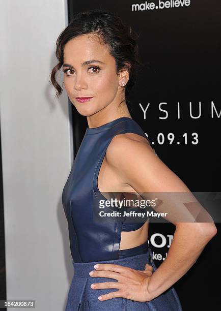 Actress Alice Braga arrives at the Los Angeles premiere of 'Elysium' at Regency Village Theatre on August 7, 2013 in Westwood, California.