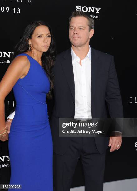 Actor Matt Damon and wife Luciana Damon arrive at the Los Angeles premiere of 'Elysium' at Regency Village Theatre on August 7, 2013 in Westwood,...