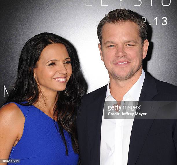Actor Matt Damon and wife Luciana Damon arrive at the Los Angeles premiere of 'Elysium' at Regency Village Theatre on August 7, 2013 in Westwood,...