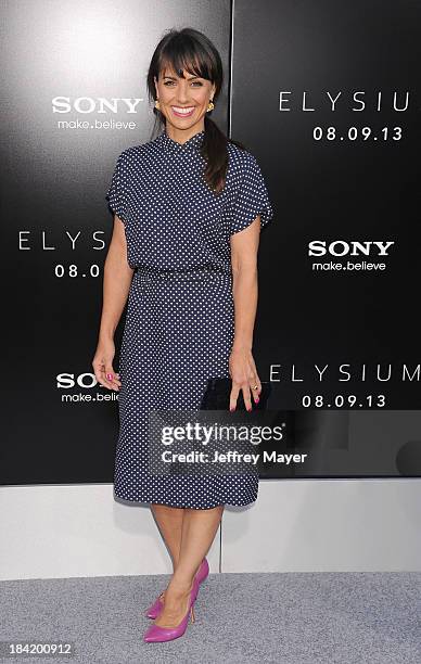 Actress Constance Zimmer arrives at the Los Angeles premiere of 'Elysium' at Regency Village Theatre on August 7, 2013 in Westwood, California.