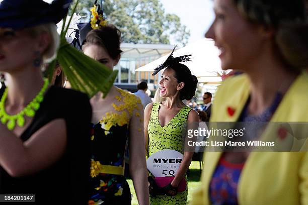 Fashions on the field contestants wait to grace the stage during Spring Champion Stakes Day at Royal Randwick on October 12, 2013 in Sydney,...