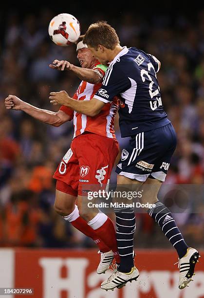 Harry Kewell of the Heart and Adrian Leijer of the Victory contest for the ball during the round one A-League match between the Melbourne Victory and...