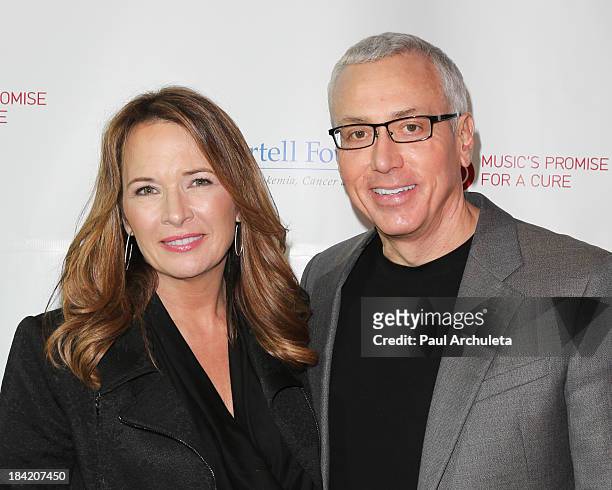 Dr. Drew Pinsky and his wife Susan Pinsky attend the T.J. Martell foundation's 3rd annual artworks for the cure charity event at Barker Hangar on...