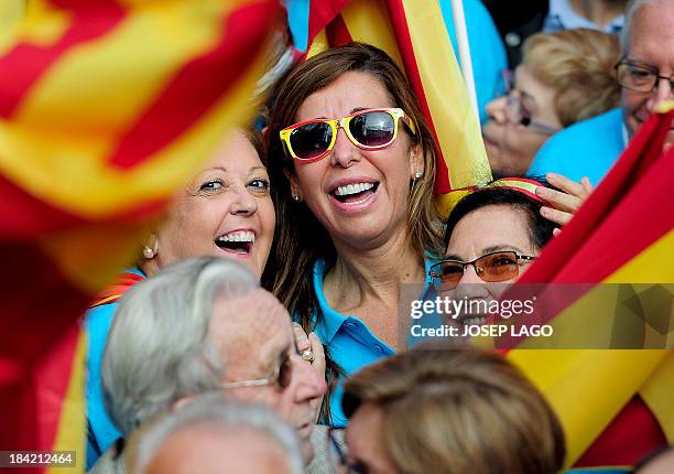 Popular Party's leader of the Catalonia region Alicia Sanchez Camacho smiles during a demonstration for the unity of Spain at Catalunya square in...