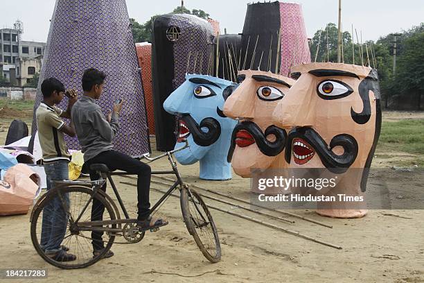 Effigies of demon king Ravana ready to burn on the eve of Dussehra festival on October 12, 2013 in Gurgaon, India. The effigies are burnt during...