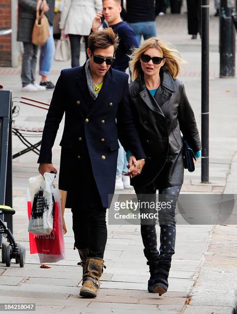 Kate Moss and Jamie Hince go shopping in North London on October 12, 2013 in London, England.