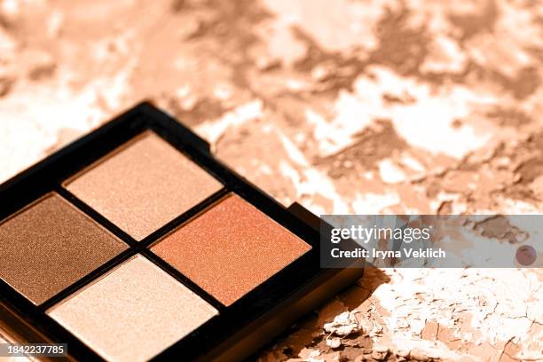 matte texture of eyeshadow palette in pastel beige orange peach color, gray, white color on painted background. - eyeshadow stock pictures, royalty-free photos & images